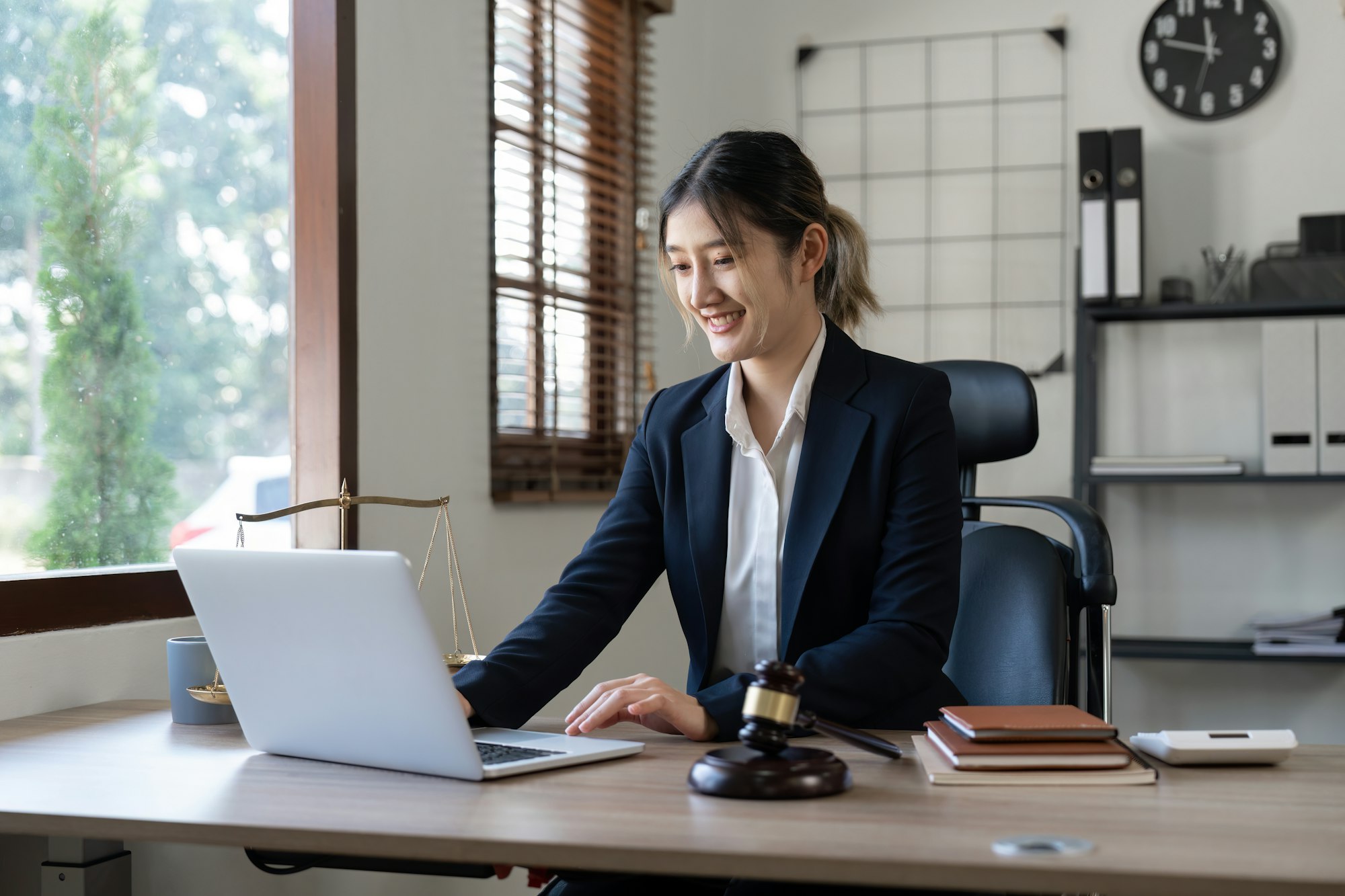 Attractive young lawyer in office Business woman and lawyers discussing contract papers with brass